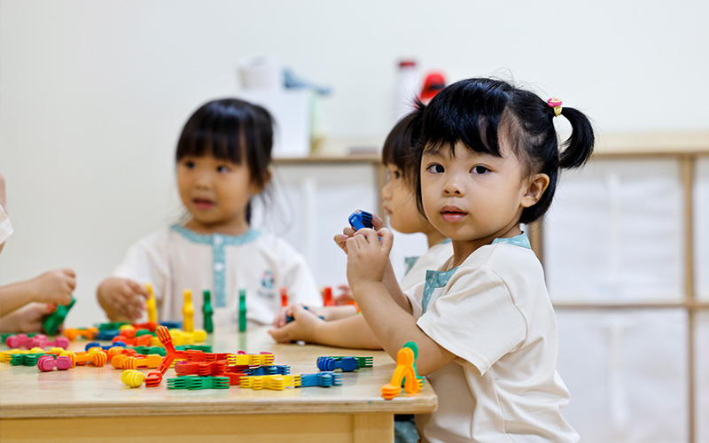 Children playing and sharing toys