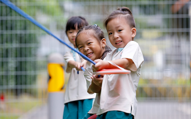 Preschool children working together on a physical activity